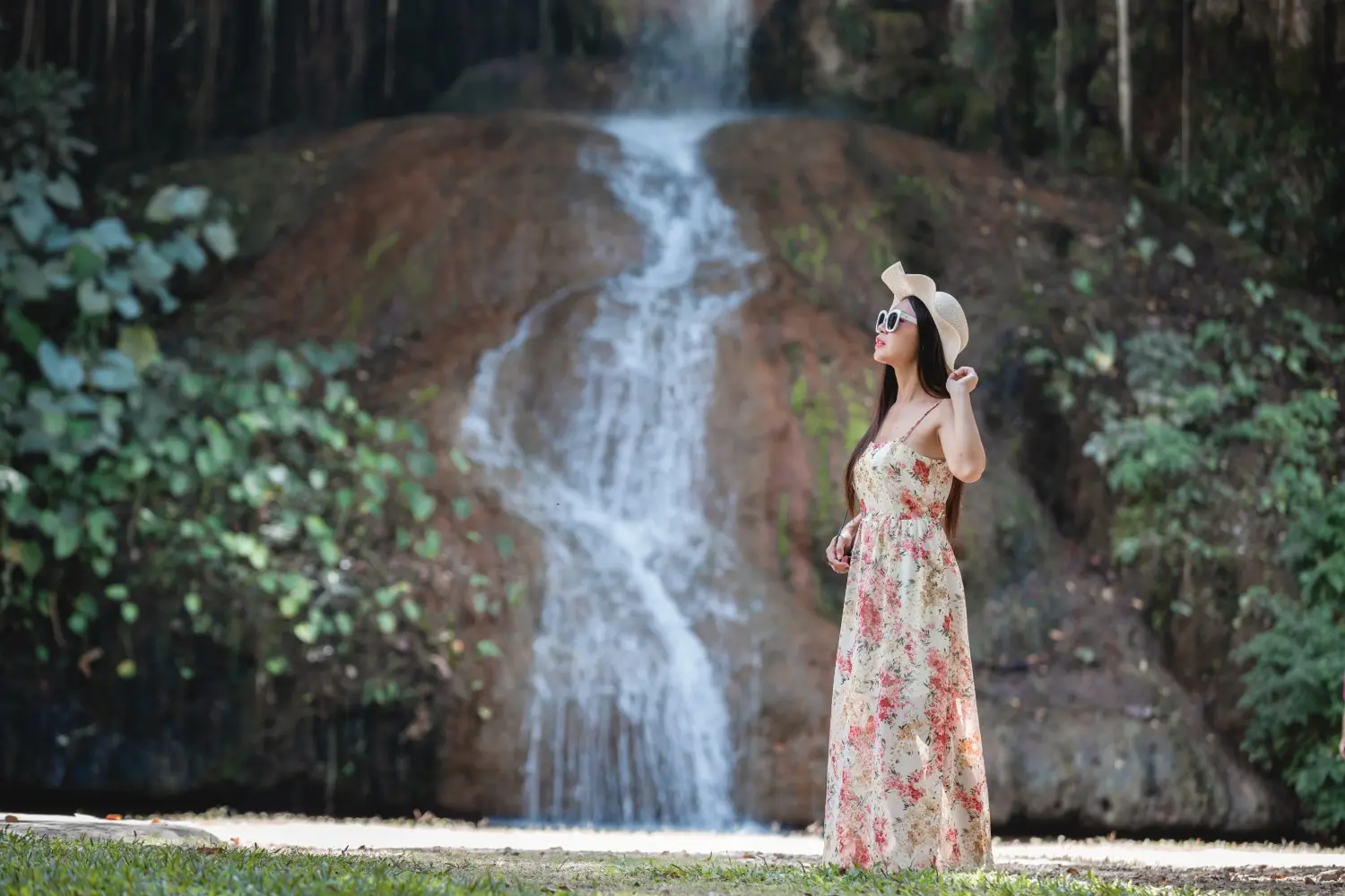 Woman by waterfall